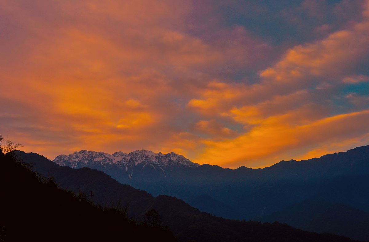snowy mountain at sunset