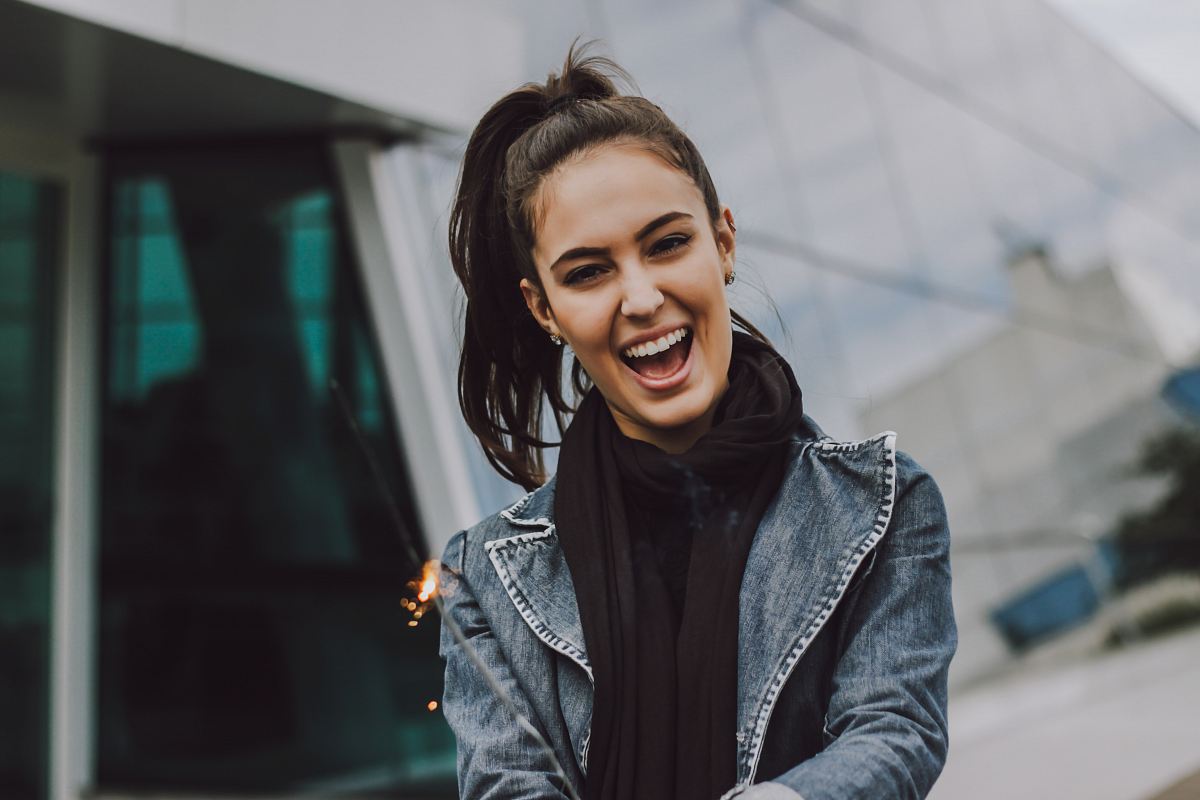 woman wearing gray denim jacket and black scarf