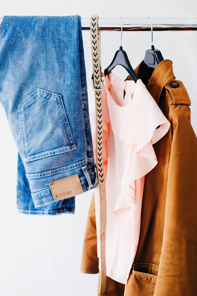 women's four assorted apparel hanged on clothes rack