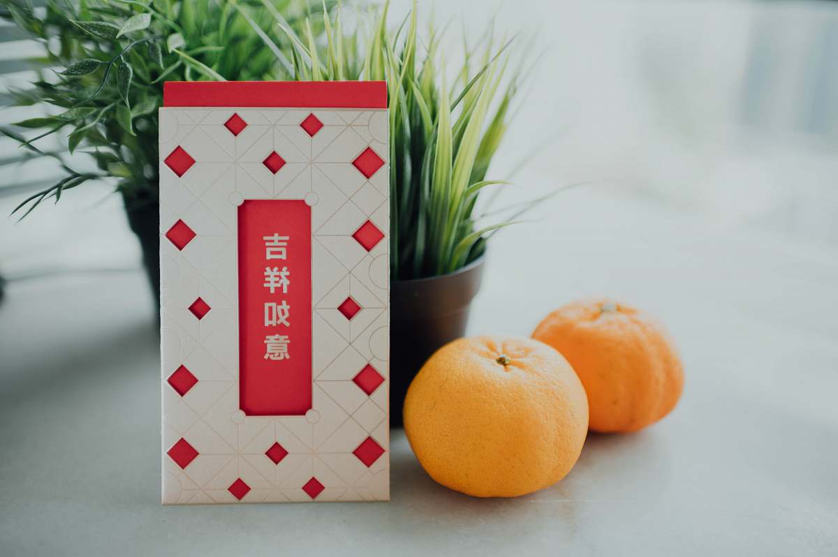 plant orange fruit on white and red checkered table citrus fruit