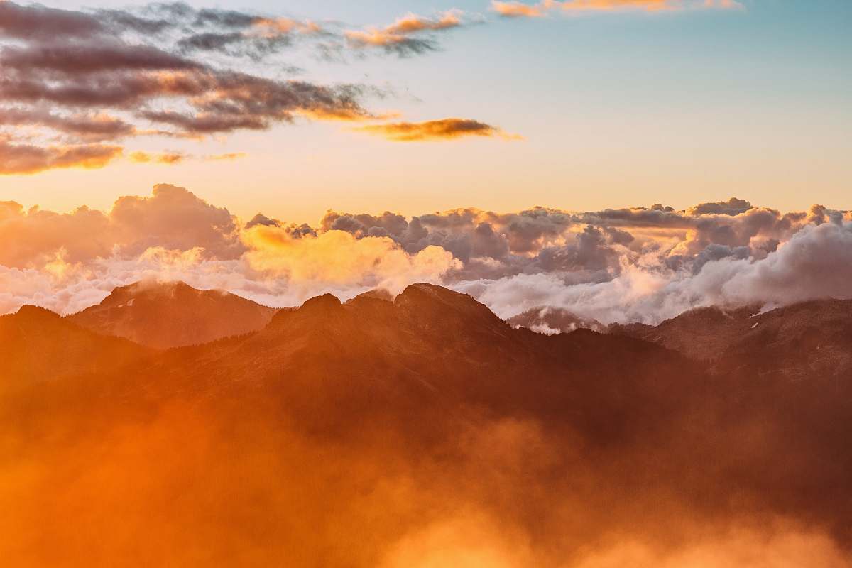 nature landscape photography of mountains with cloudy skies during golden hour sunset
