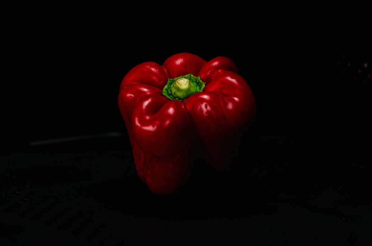 food selective focus photography of red bell pepper apple