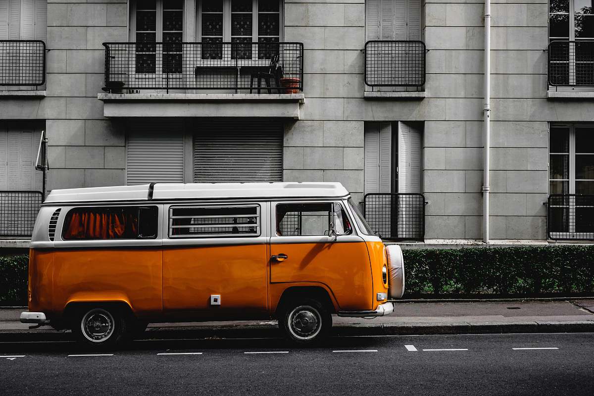 caravan white and orange Volkswagen Kombi on road transportation
