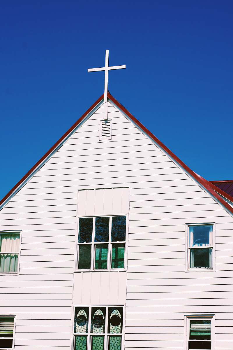 church white and red building housing