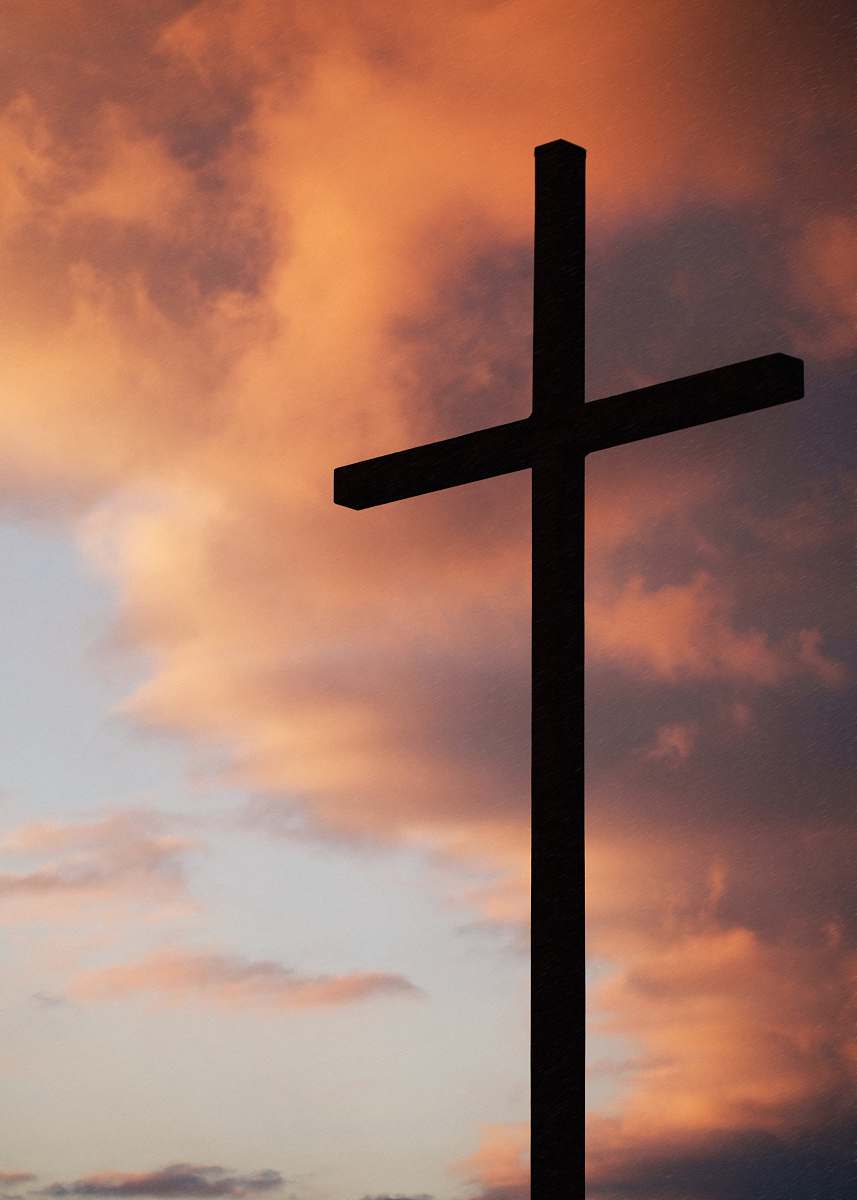 church silhouette of large cross under orange sky christian