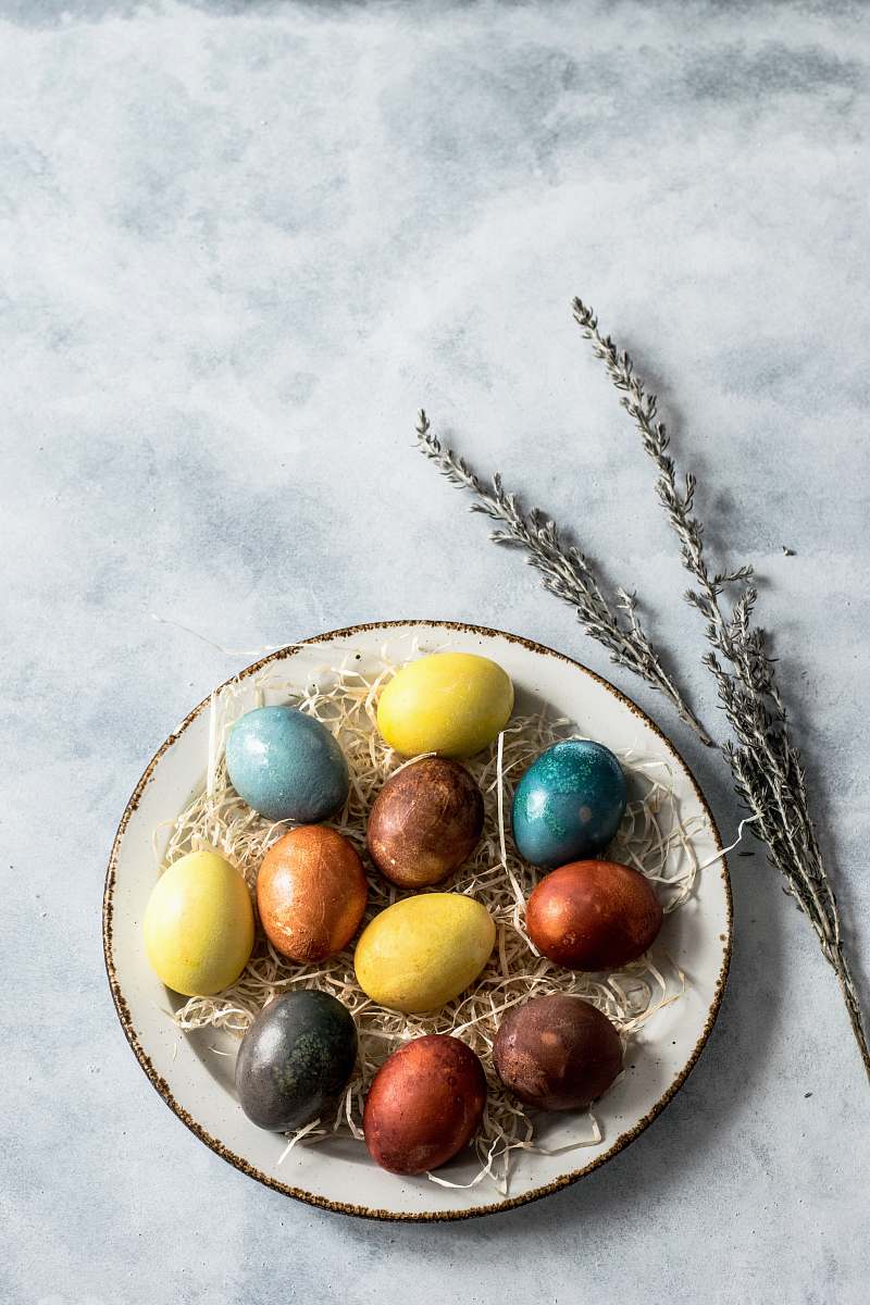 egg assorted-color eggs on white ceramic tray spring