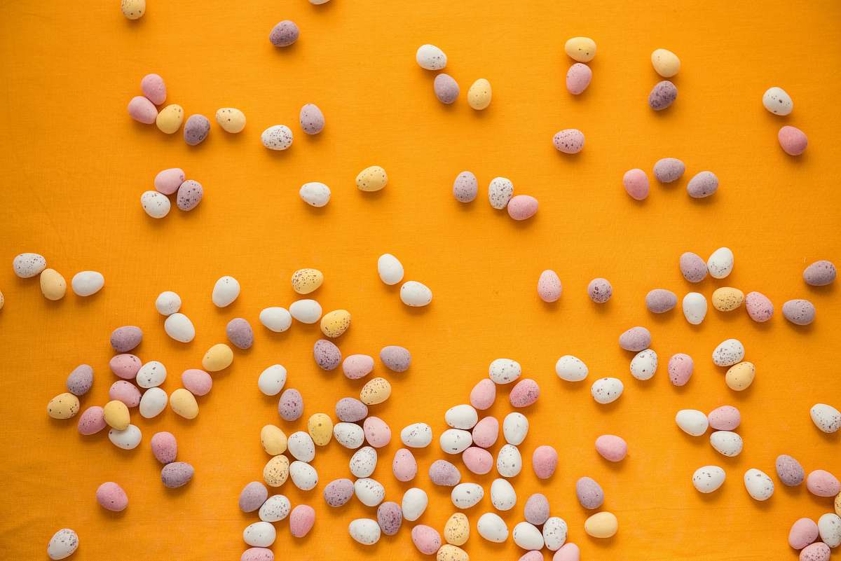 food pebble stones on orange surface candy