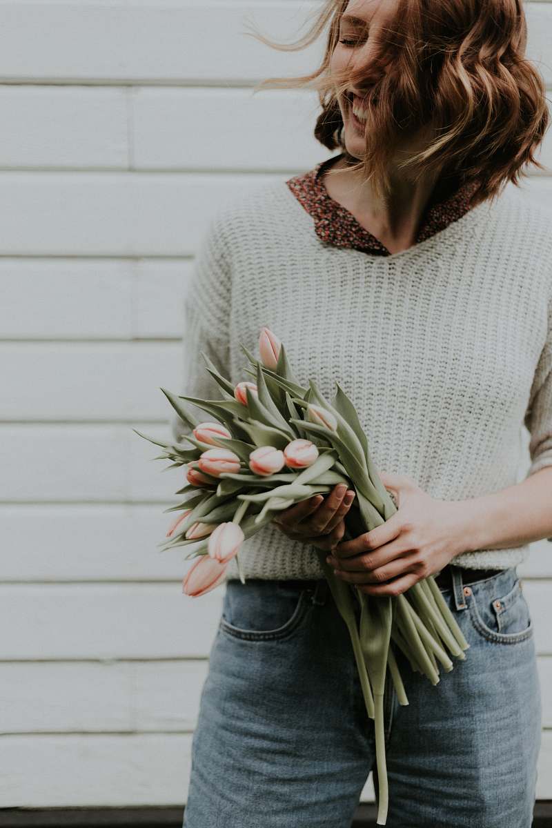 plant woman holding bouquet of tulip flowers blossom