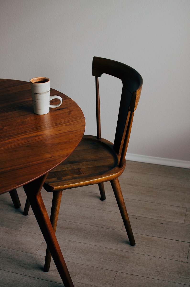 chair white ceramic mug on brown wooden table interior