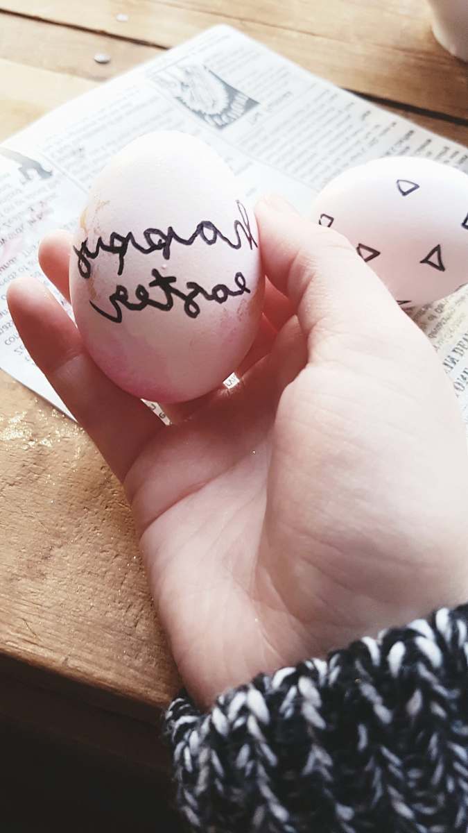 human person holding Easter egg person