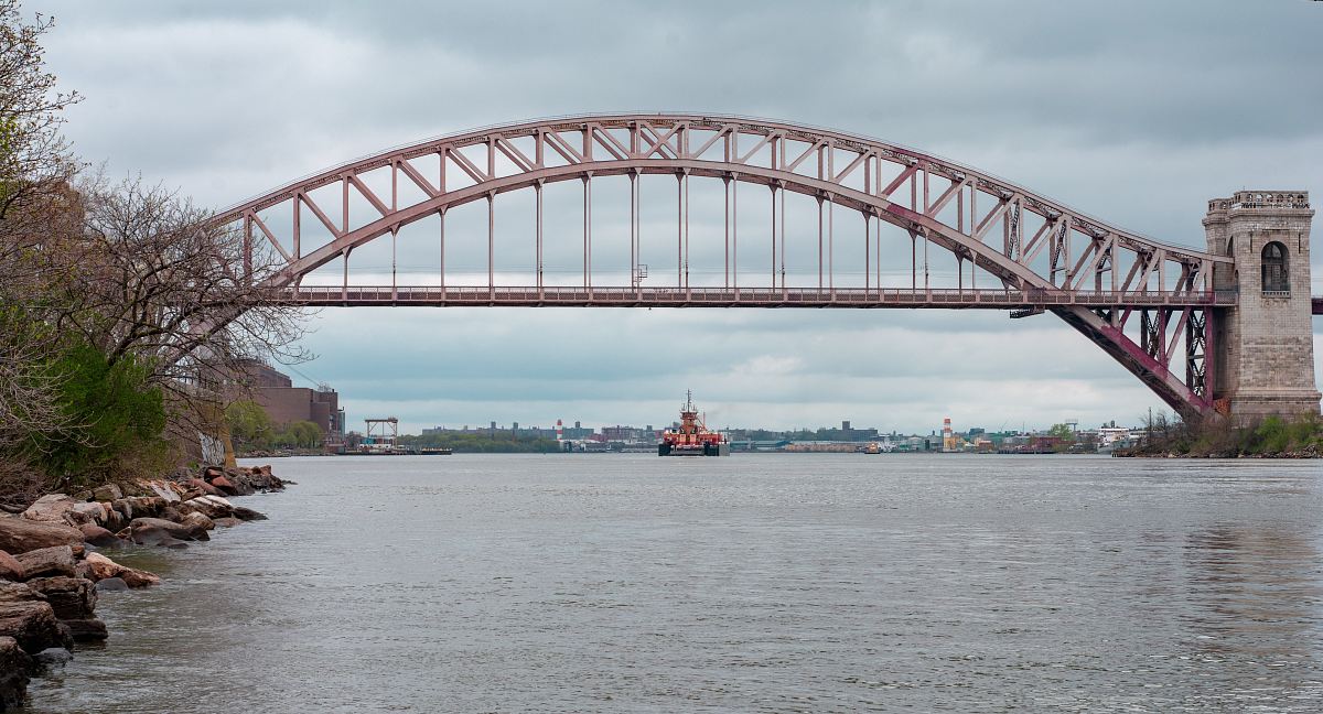 boat about to pass bridge