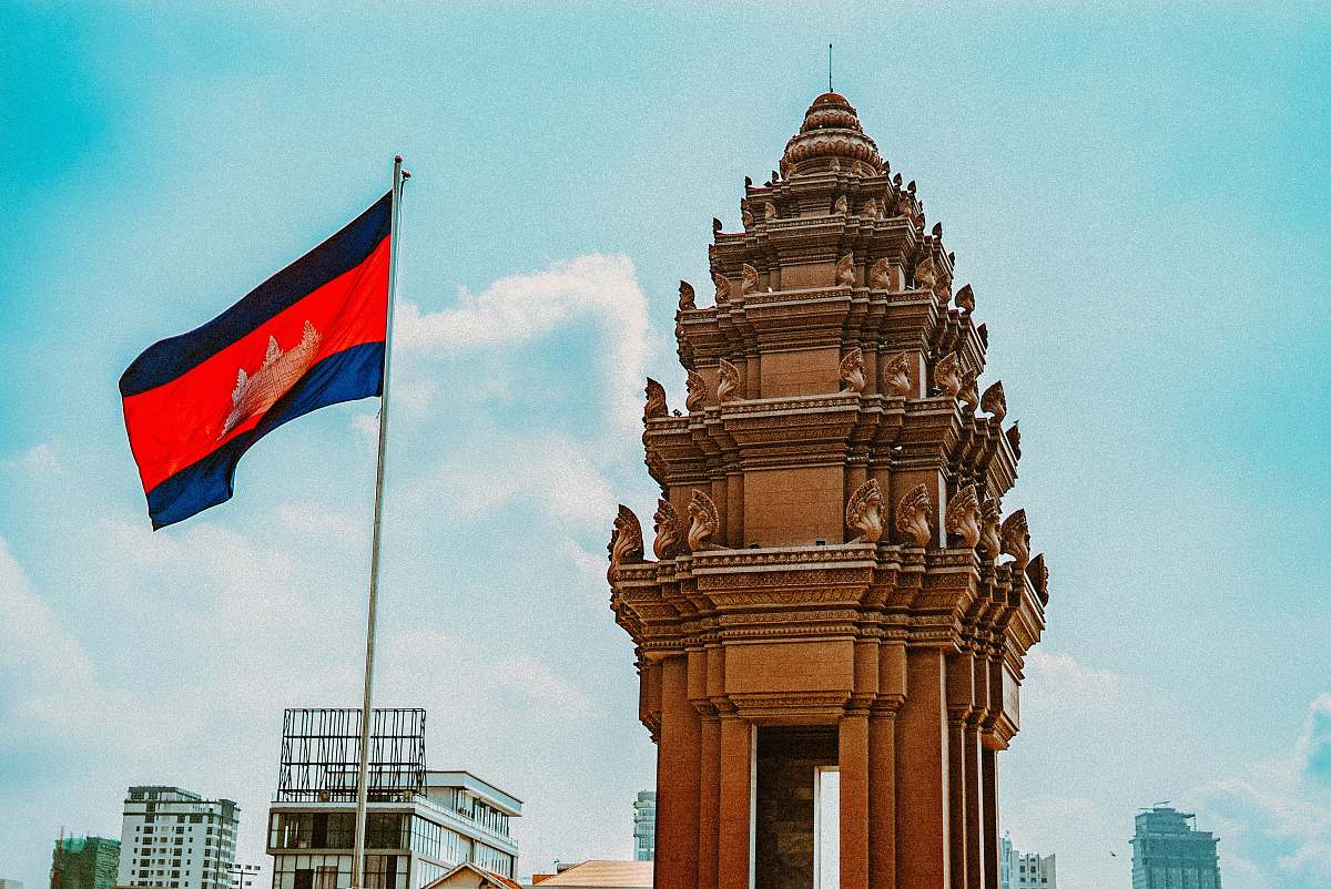 symbol brown concrete building with flag of us a during daytime phnom penh