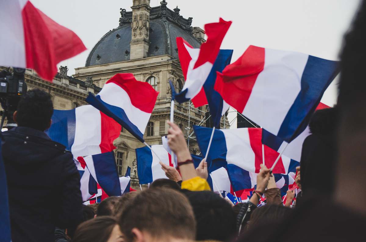 symbol people holding France flag in the street human