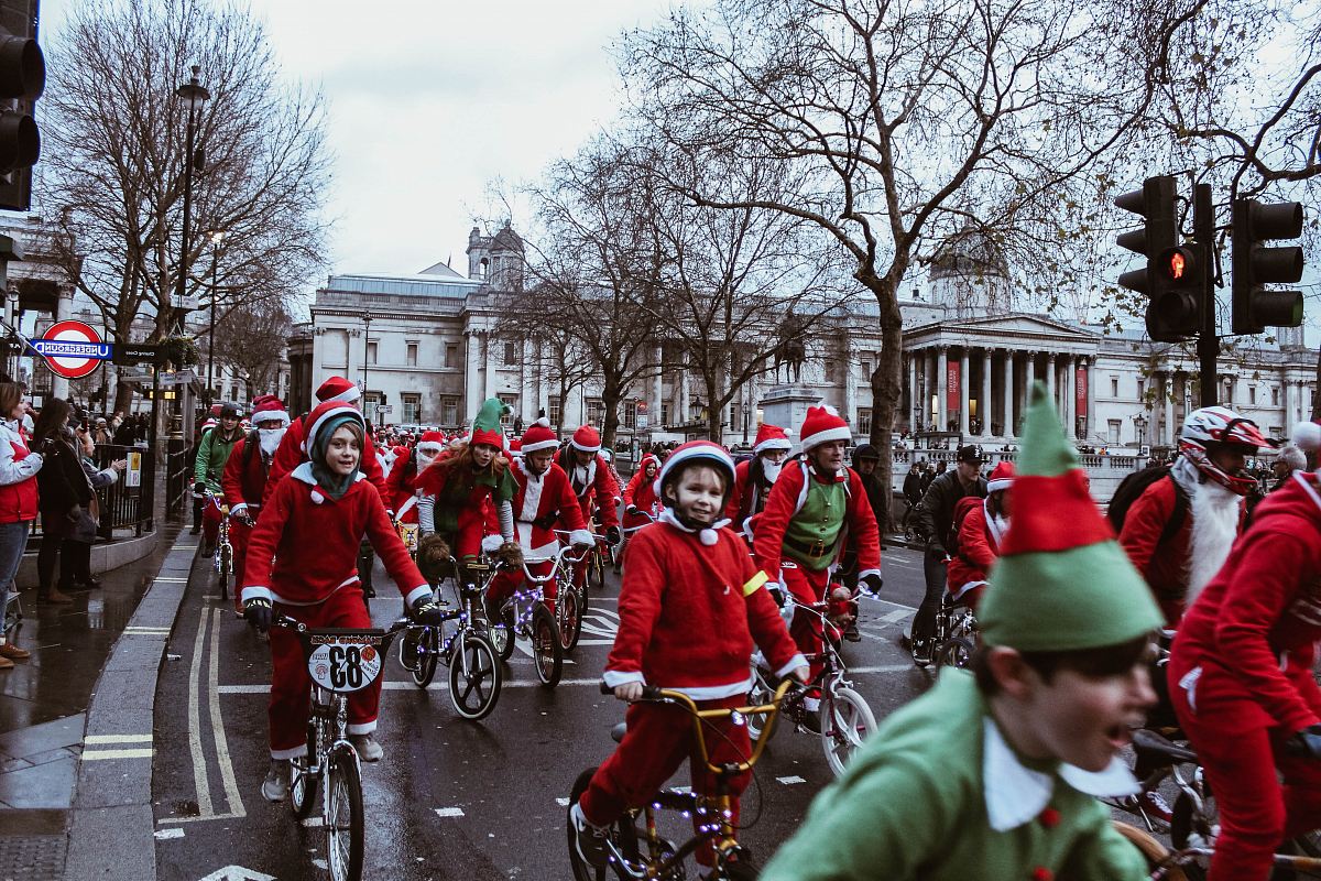 group of children in bicycle near white building