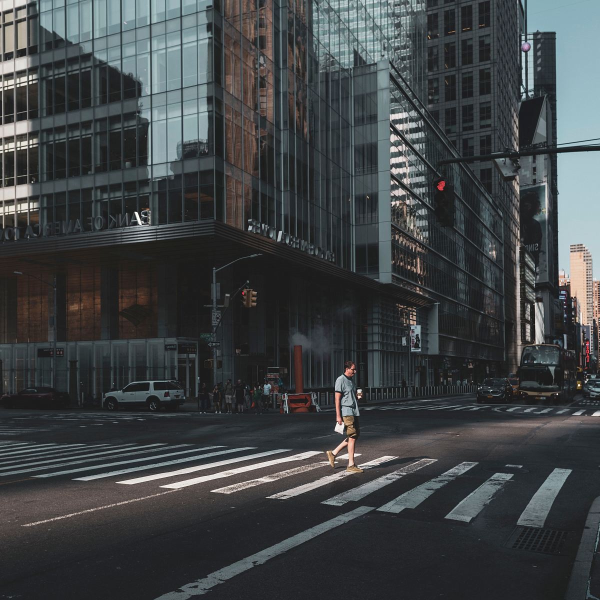 man crossing street on pedestrian lane