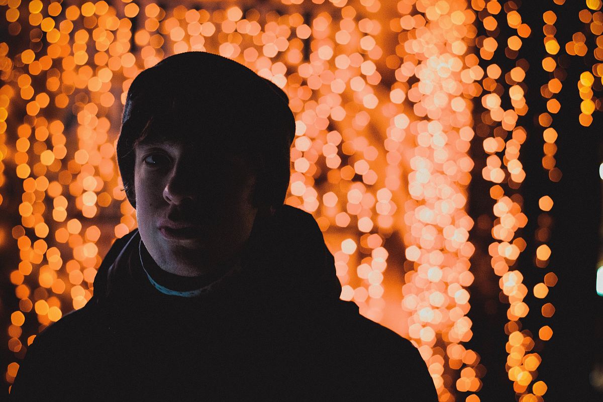 man in winter suit with light background