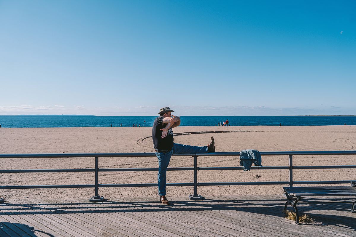 man leaning on railing
