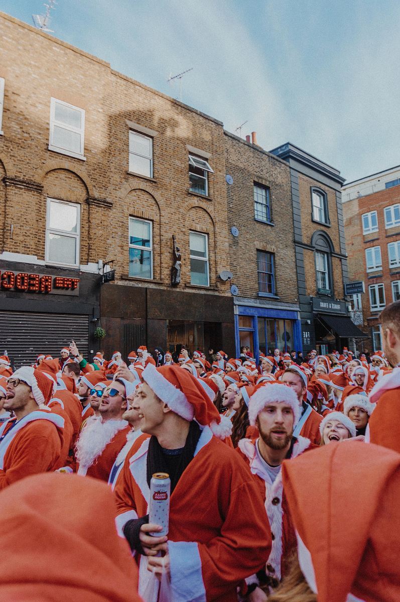 men wearing Christmas costumes