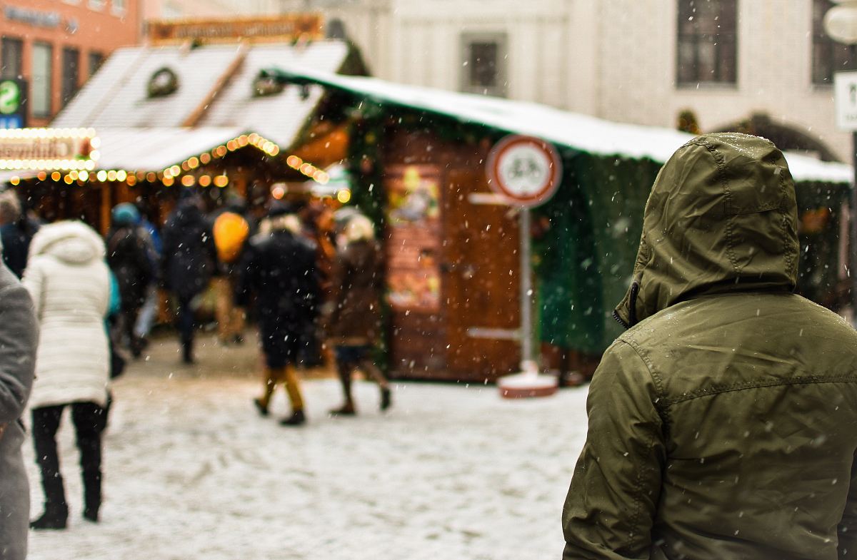 person wearing green hoodie on snow