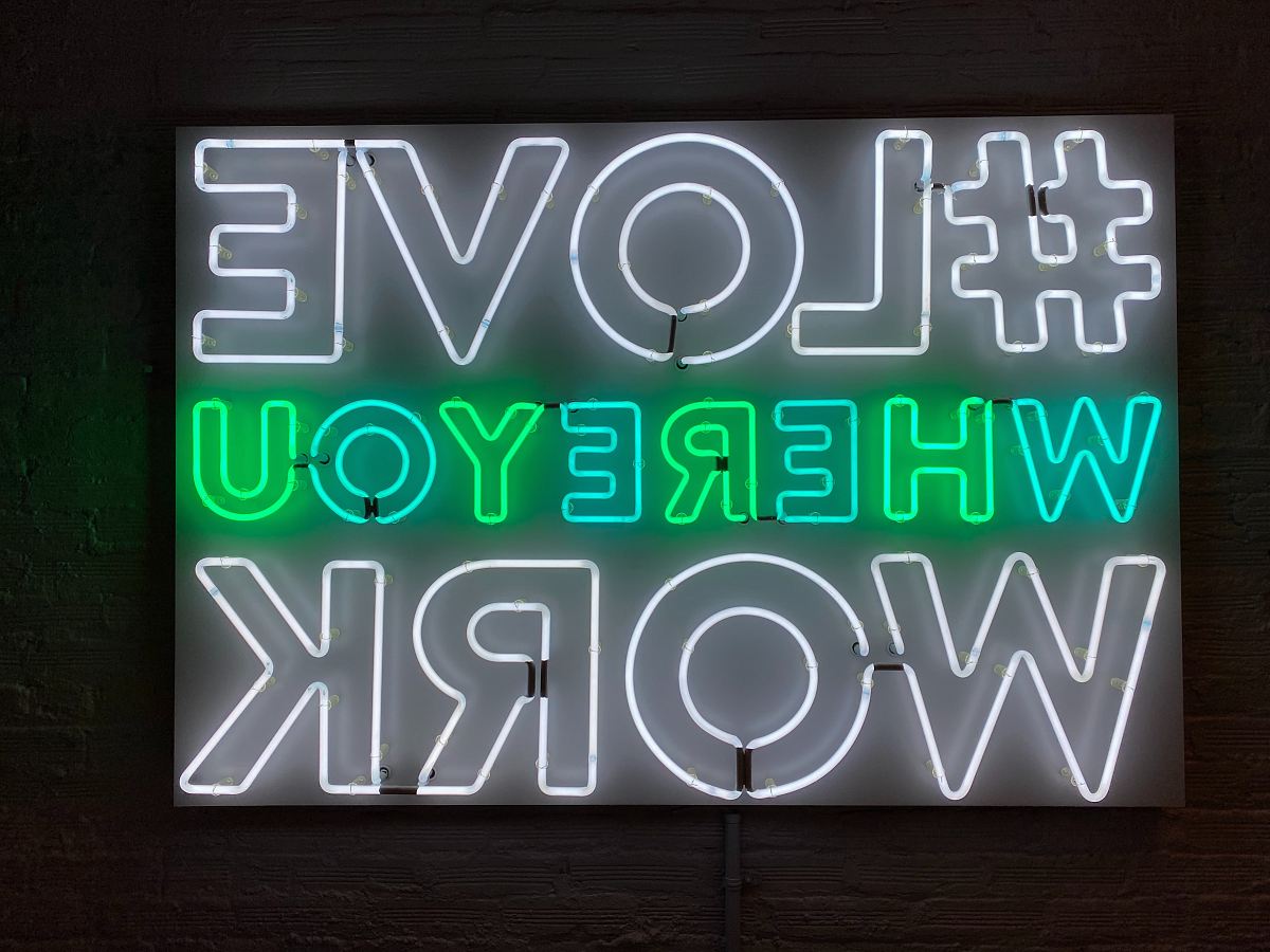 turned-on love where you work neon signage
