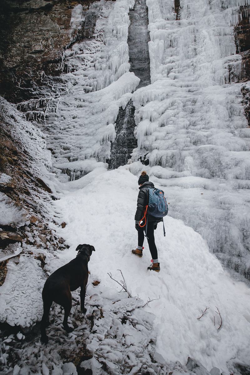 woman climbing through mountain
