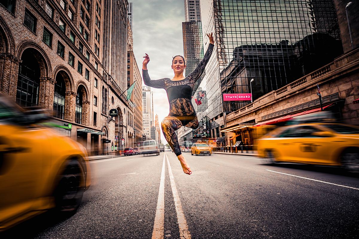 woman jumping on road