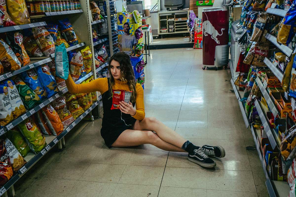 shoe woman wearing pair of black Vans low-rise shoe footwear