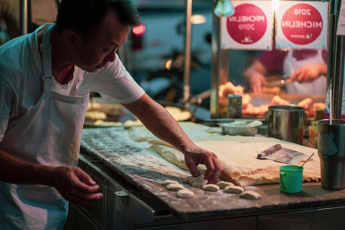 person man in white shirt doing dough human