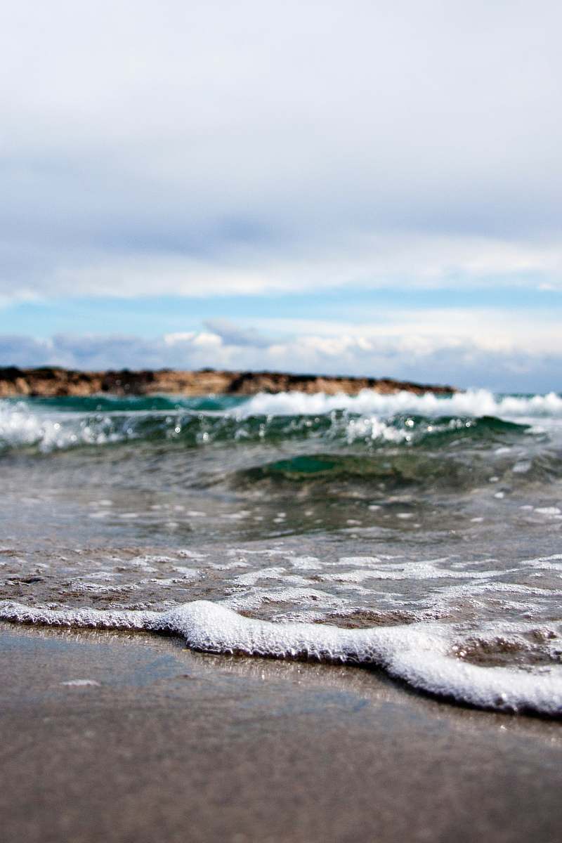 ocean waves under white cloudy sky at daytime sea