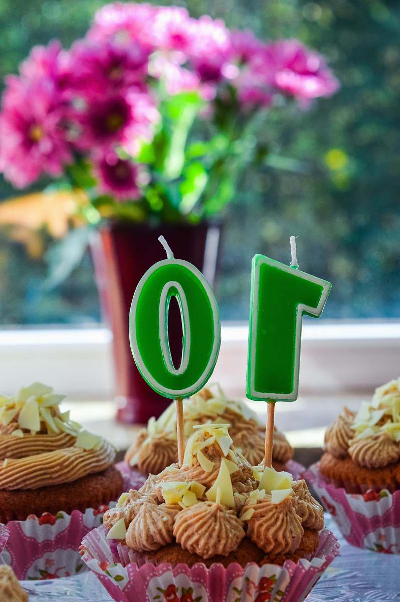 food cupcakes with green and white number 10 candle cake