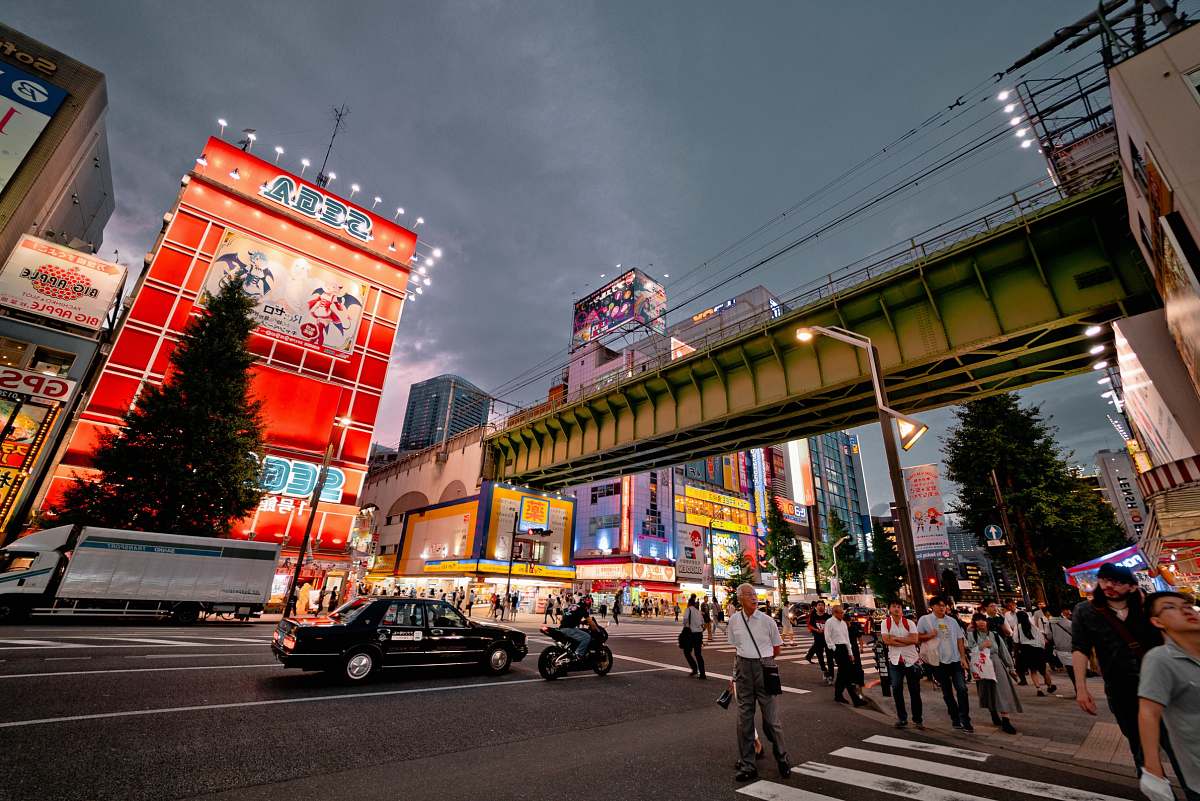 person people crossing streets during nighttime people