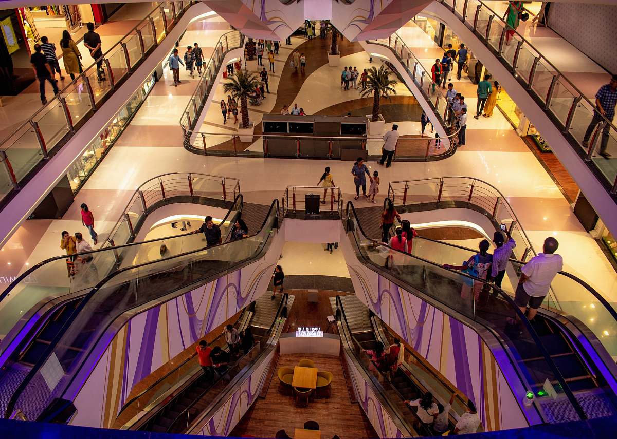 person people inside mall handrail