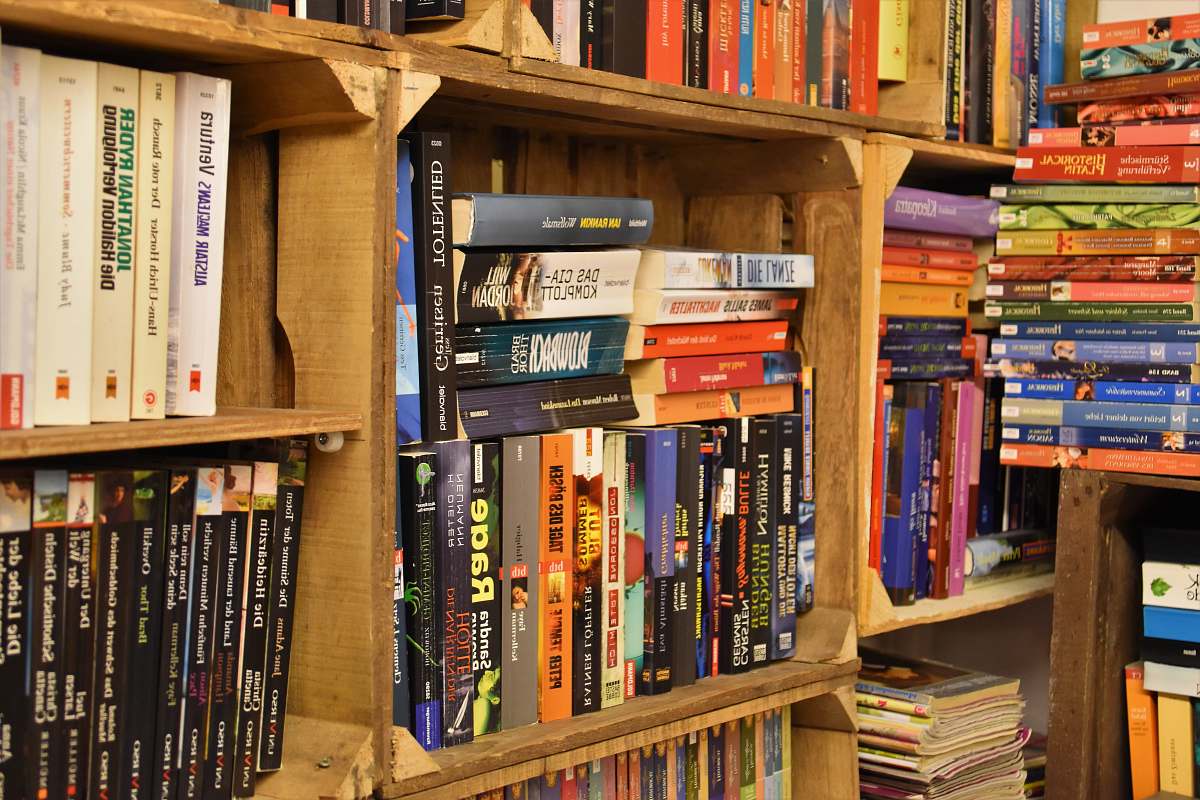 shelf pile of books on bookshelf furniture