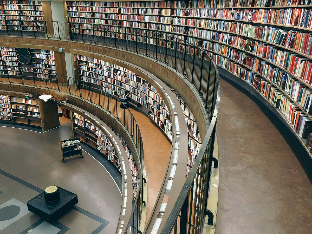 library three-storey library building with lots of books room