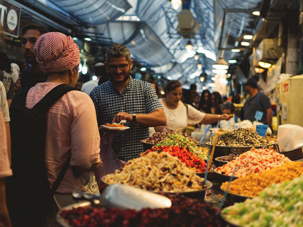 person people walking and standing beside food and spices human