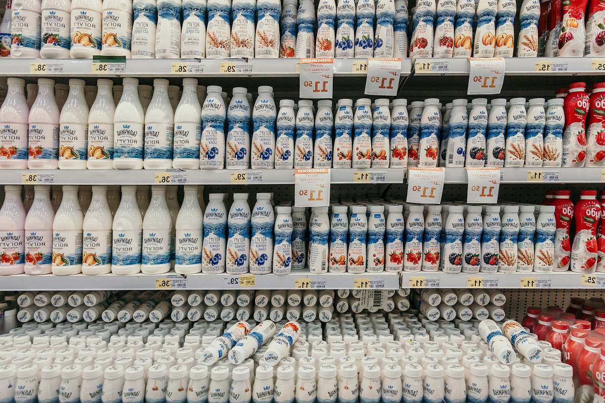 shop white and blue labeled bottles supermarket
