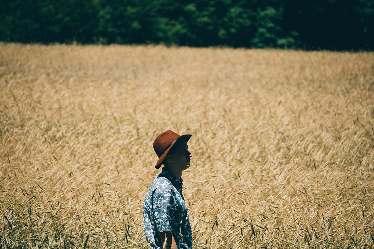 human man standing at wheat field people