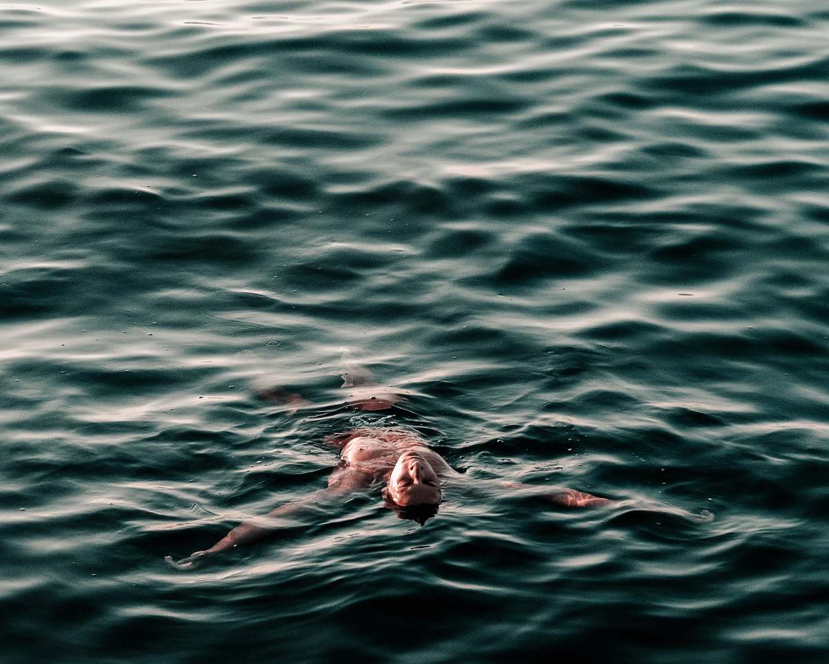 water man swimming backwards on body of water croatia