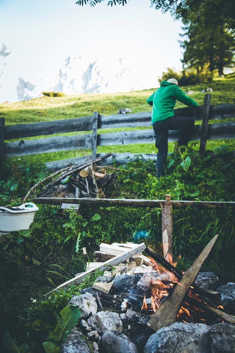 human person standing fence fire