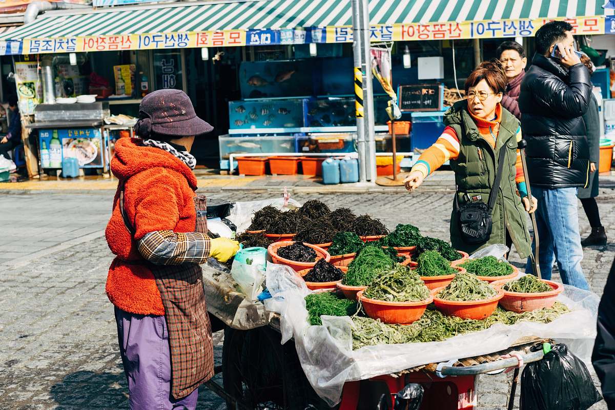 human person wearing black bucket hat market