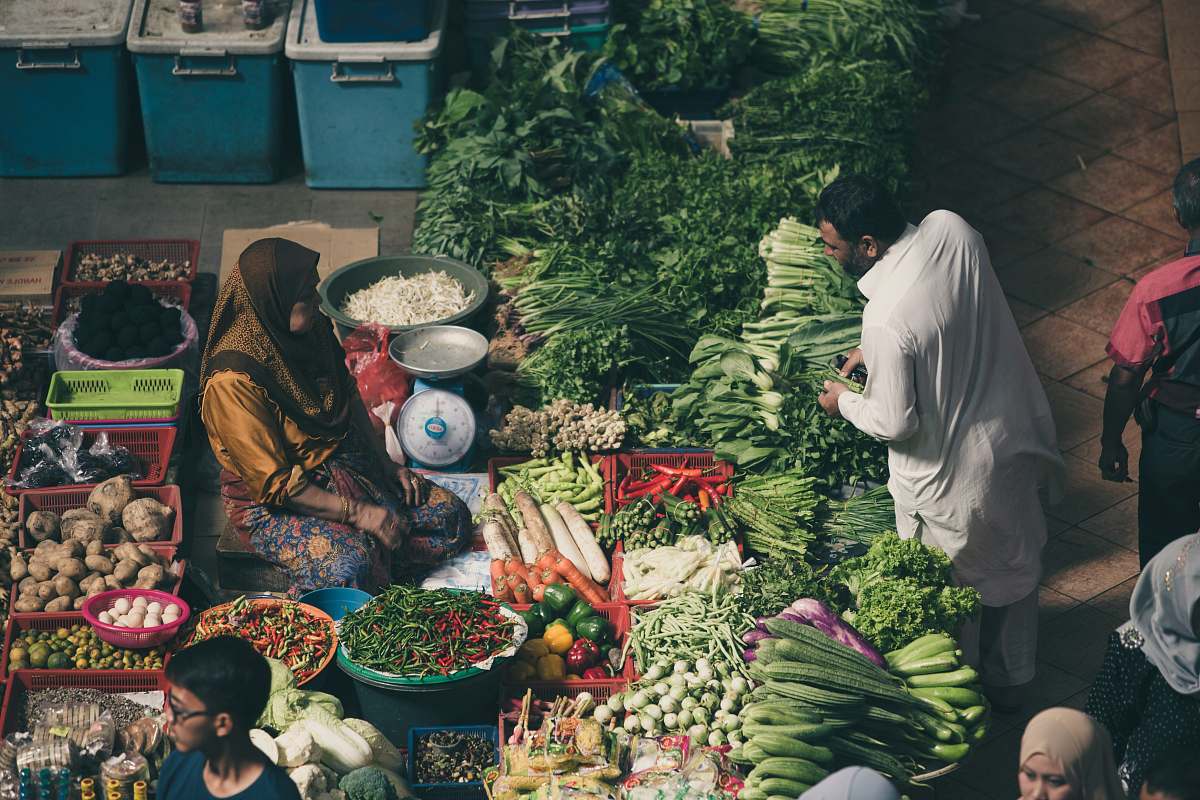 human woman vending vegetables market
