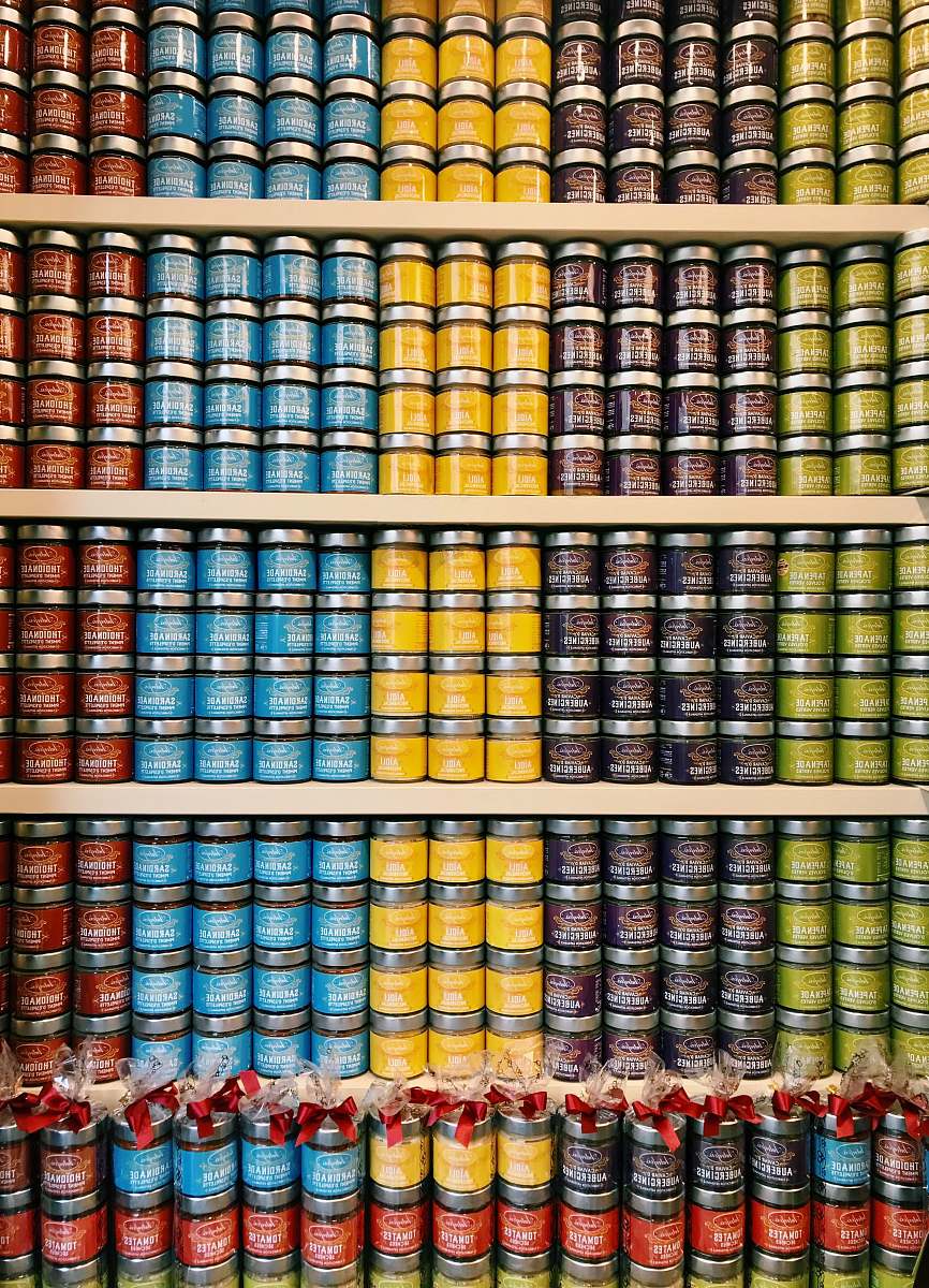 supermarket green, brown, yellow, blue, and red labeled jars grocery store