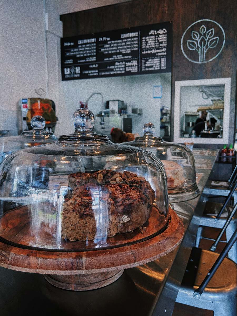 bakery coffee shop sells two cakes inside dome glasses confectionery
