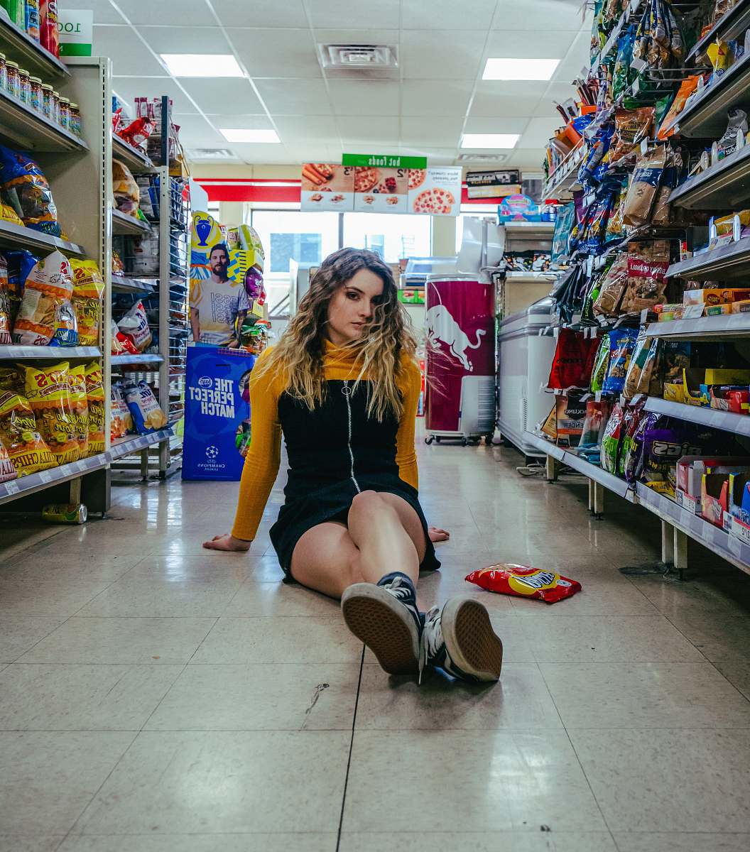 market woman in yellow and black long-sleeved dress supermarket