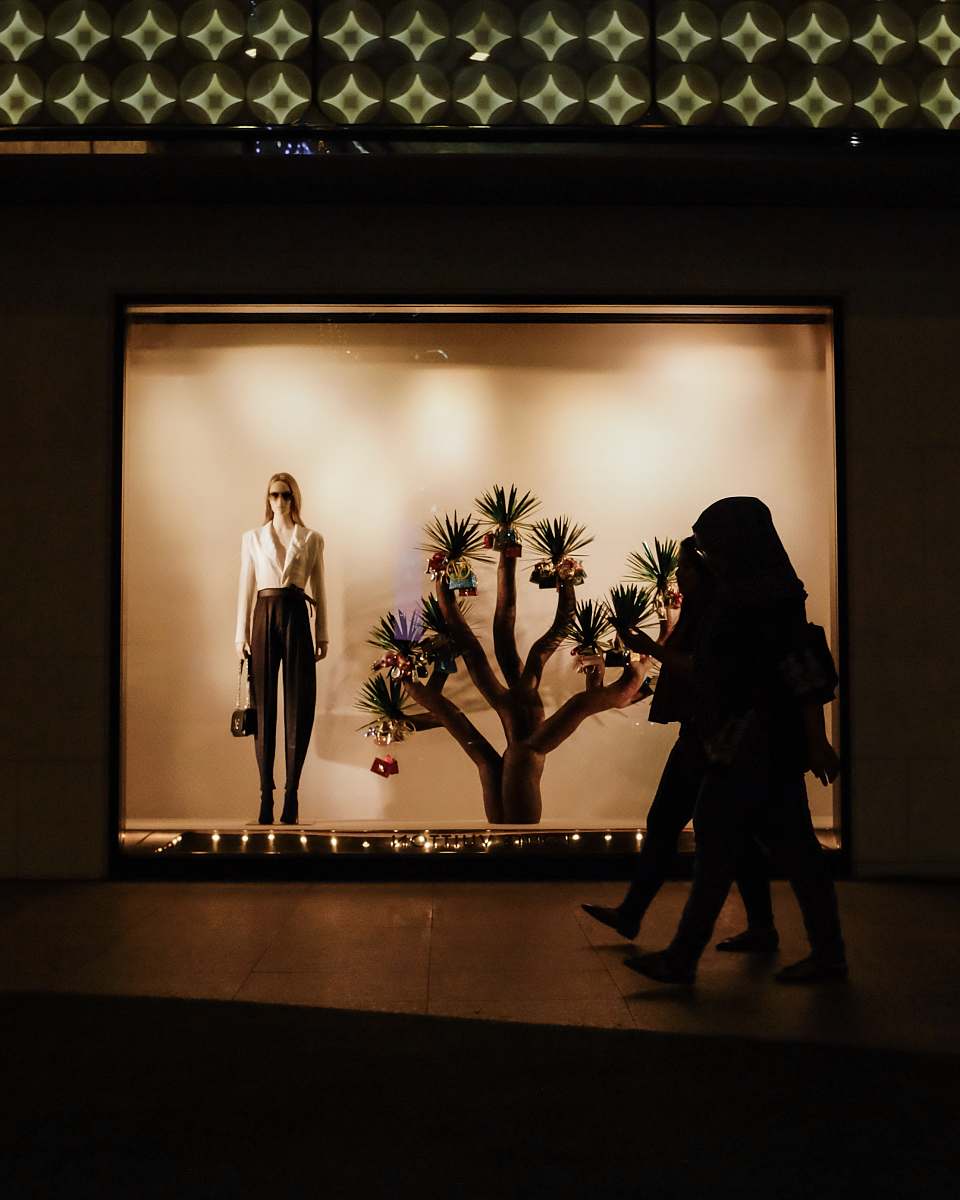 human woman walking inside mall person