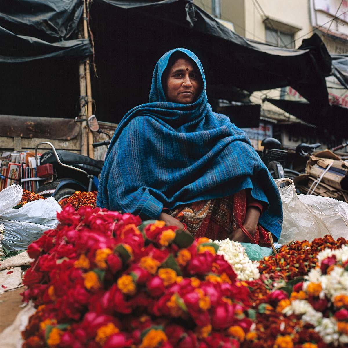 market woman wearing blue top bazaar