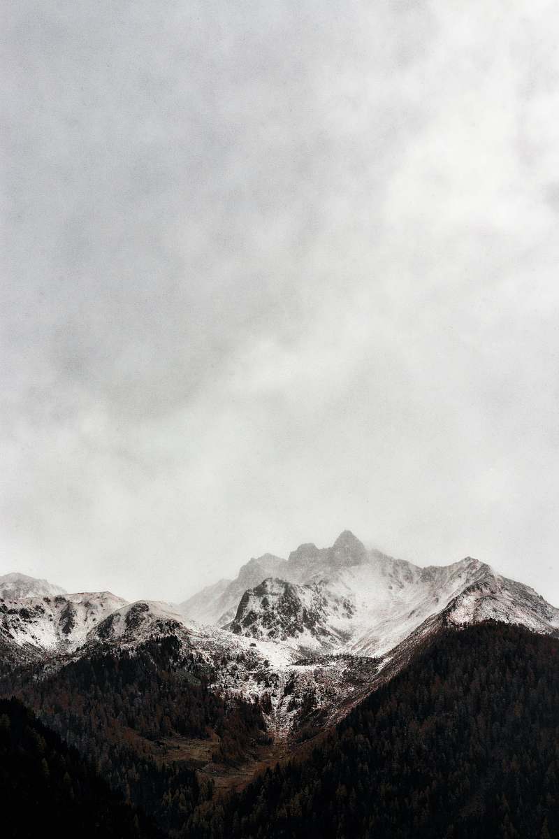 nature iced cap mountain under gray sky during daytime photography grey