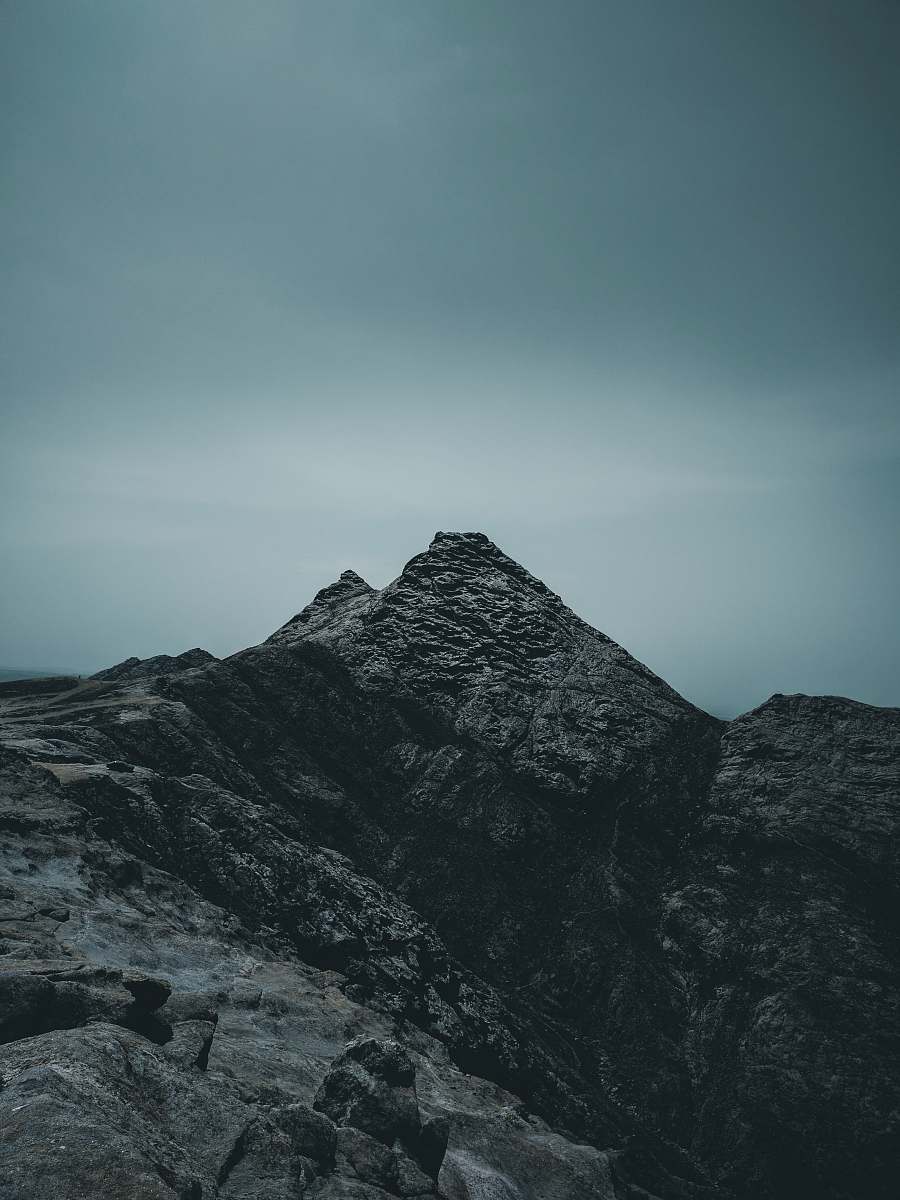 nature rock mountain under cloudy sky crest