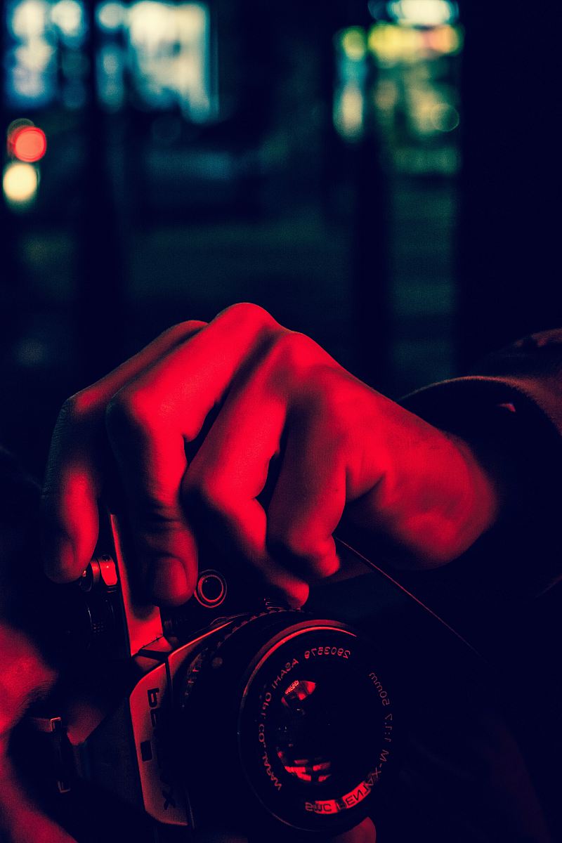 In this captivating scene, a photographer focuses his camera on a woman, capturing the essence of spontaneous moments. The interaction between the man and woman showcases the art of photography, emphasizing the beauty of candid shots and personal connections. This image is perfect for use in blogs, articles, or marketing campaigns related to photography, relationships, or creative art.