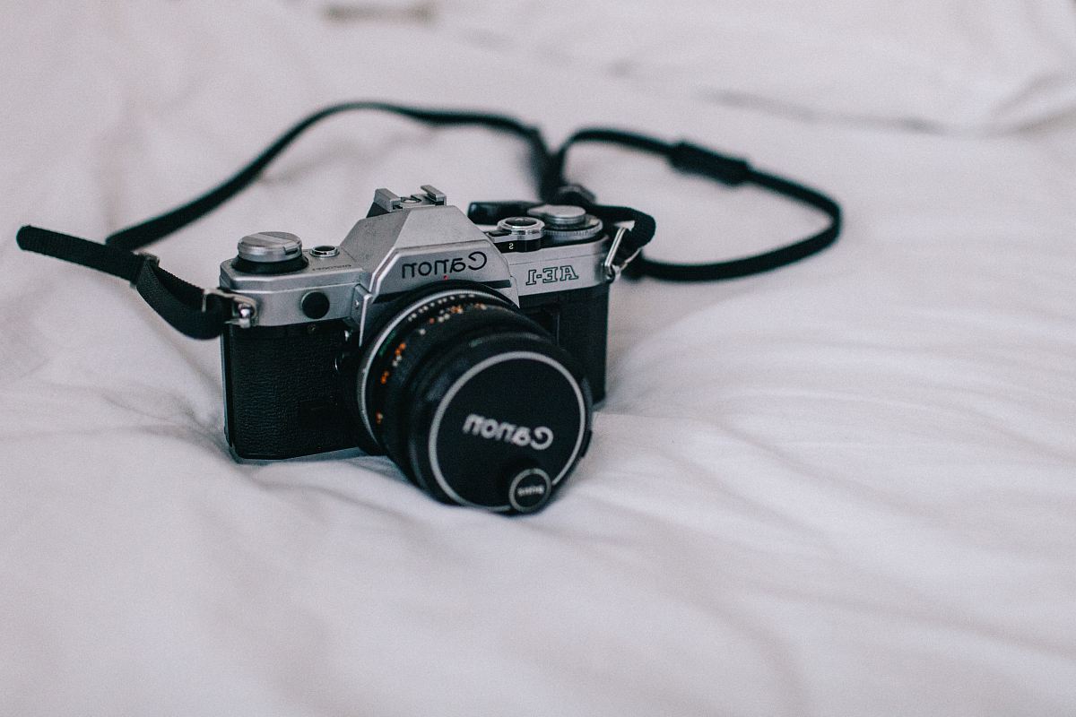 black and silver Canon DSLR camera